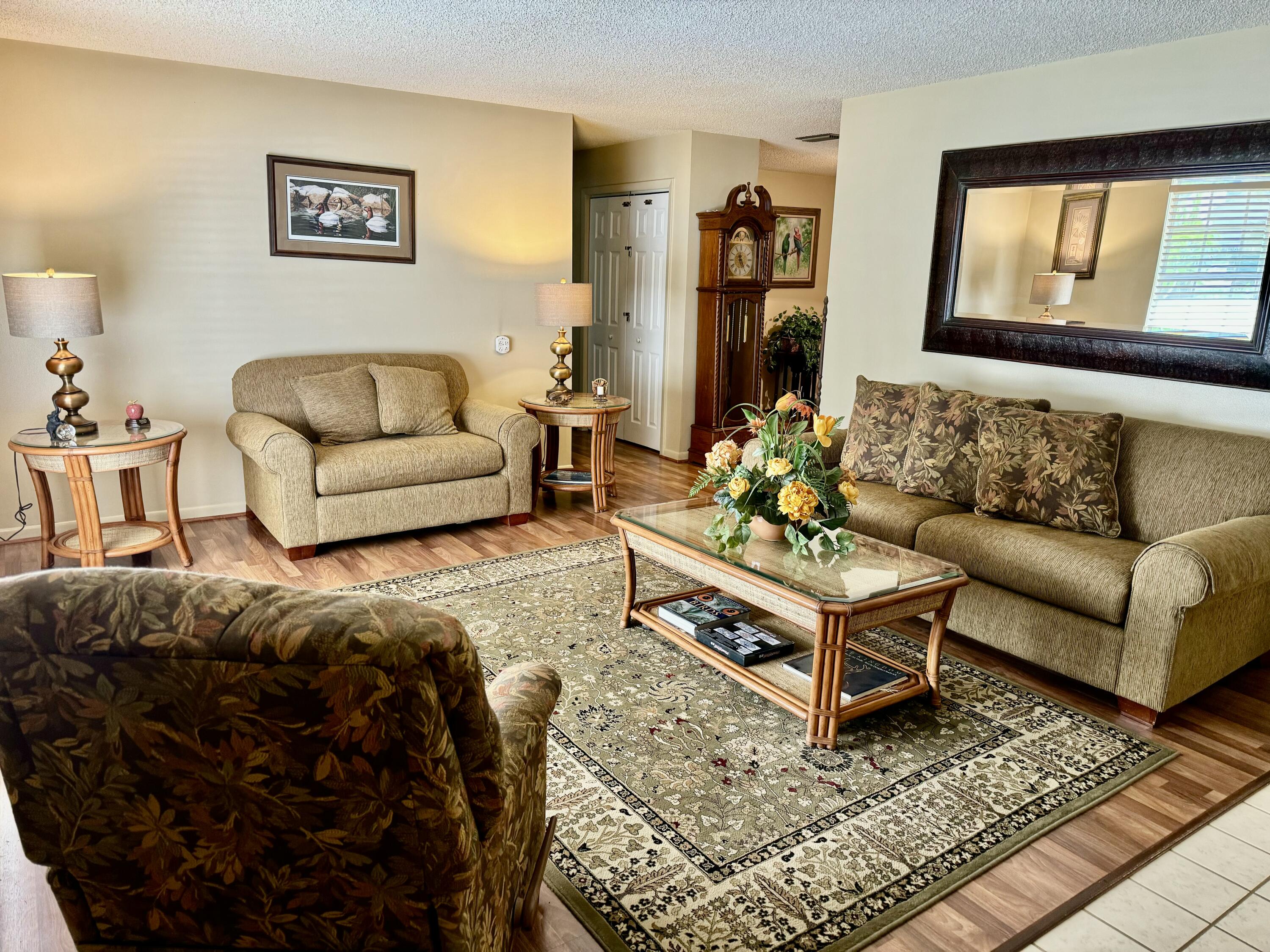 1515 Southwest 19th Terrace Okeechobee, FL 34974 - Photo 3 of 39 a living room with furniture and a rug