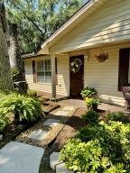 1515 Southwest 19th Terrace Okeechobee, FL 34974 - Photo 32 of 39 a front view of a house with a yard