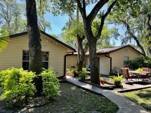 1515 Southwest 19th Terrace Okeechobee, FL 34974 - Photo 33 of 39 a front view of a house with garden