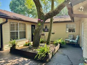 1515 Southwest 19th Terrace Okeechobee, FL 34974 - Photo 35 of 39 a front view of a house with outdoor seating