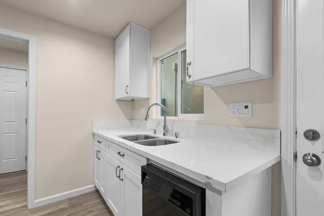 a utility room with cabinets