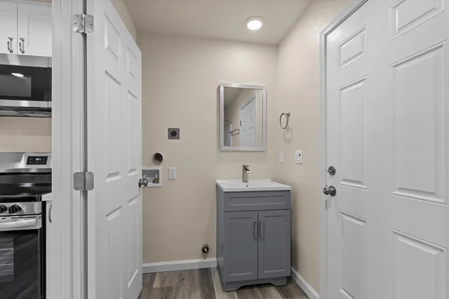 a bathroom with a sink and mirror