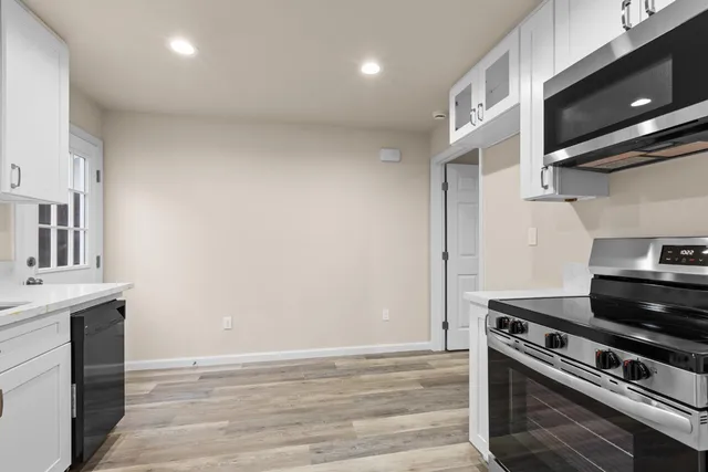 a kitchen with a stove and a microwave
