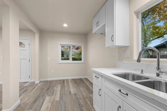 a kitchen with a sink and cabinets