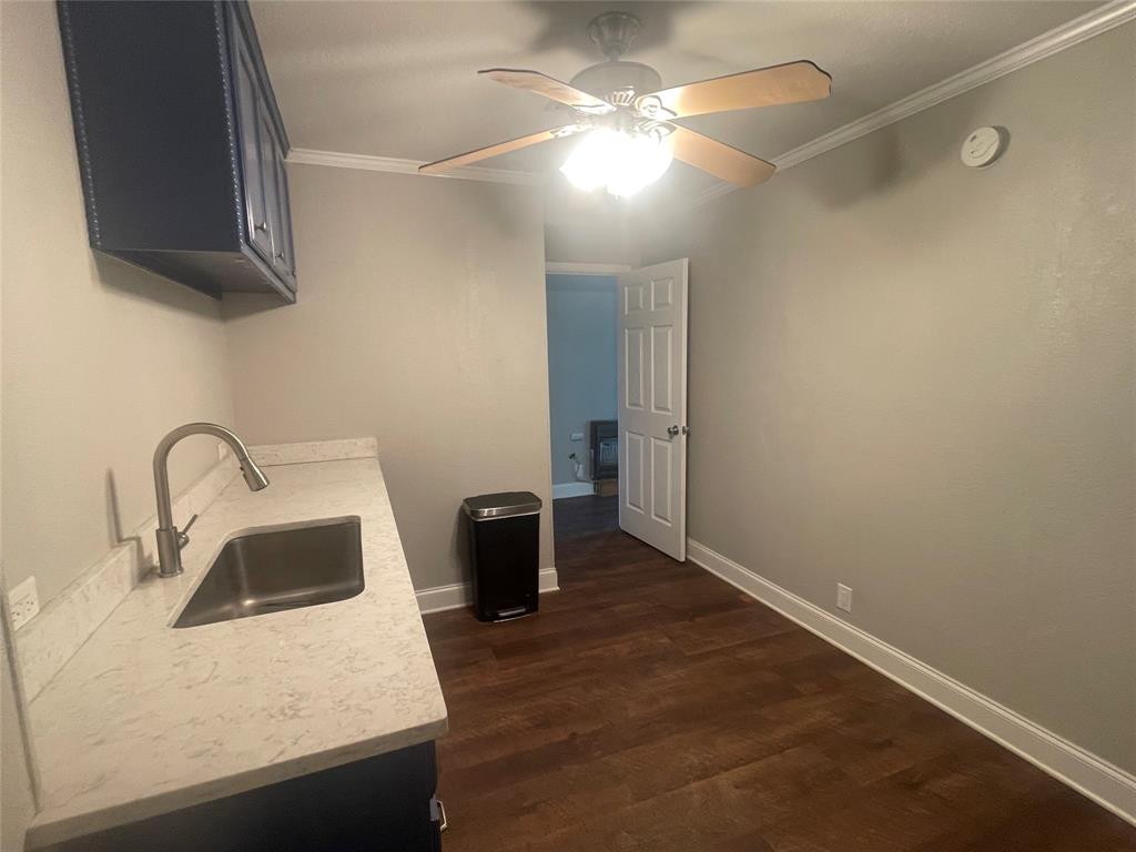 180 Cr 3320 Road Avery, TX 75554 - Photo 14 of 18 a kitchen with a sink and a refrigerator