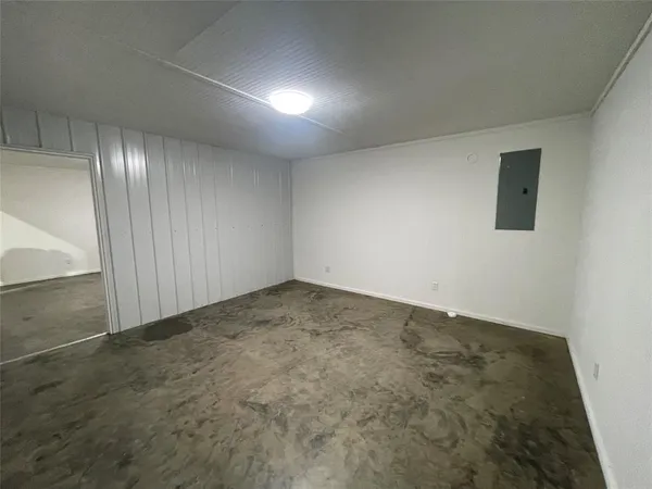 an empty room with a empty space and windows