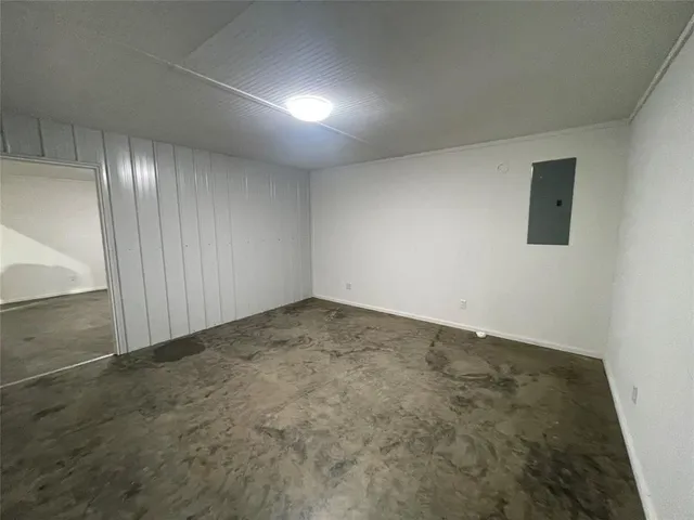 an empty room with a empty space and windows