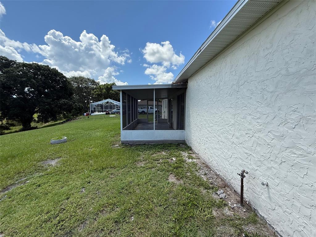 7319 Holiday Drive Spring Hill, FL 34606 - Photo 15 of 20 a view of a backyard with a garden