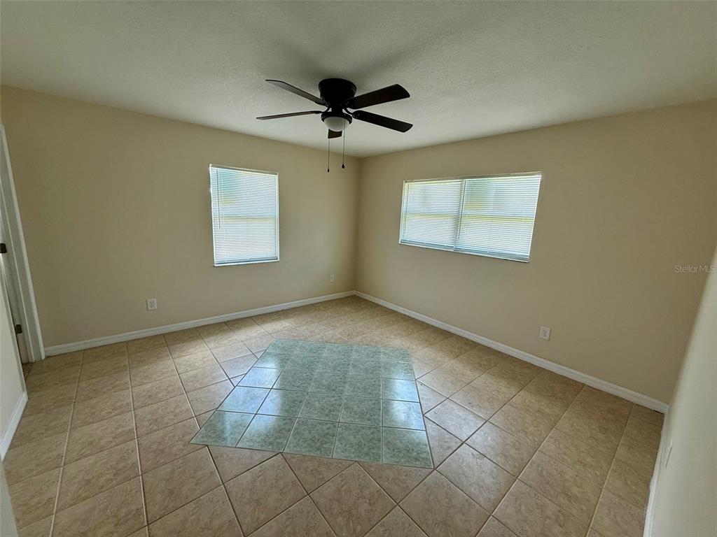 7319 Holiday Drive Spring Hill, FL 34606 - Photo 8 of 20 a view of an empty room with a window