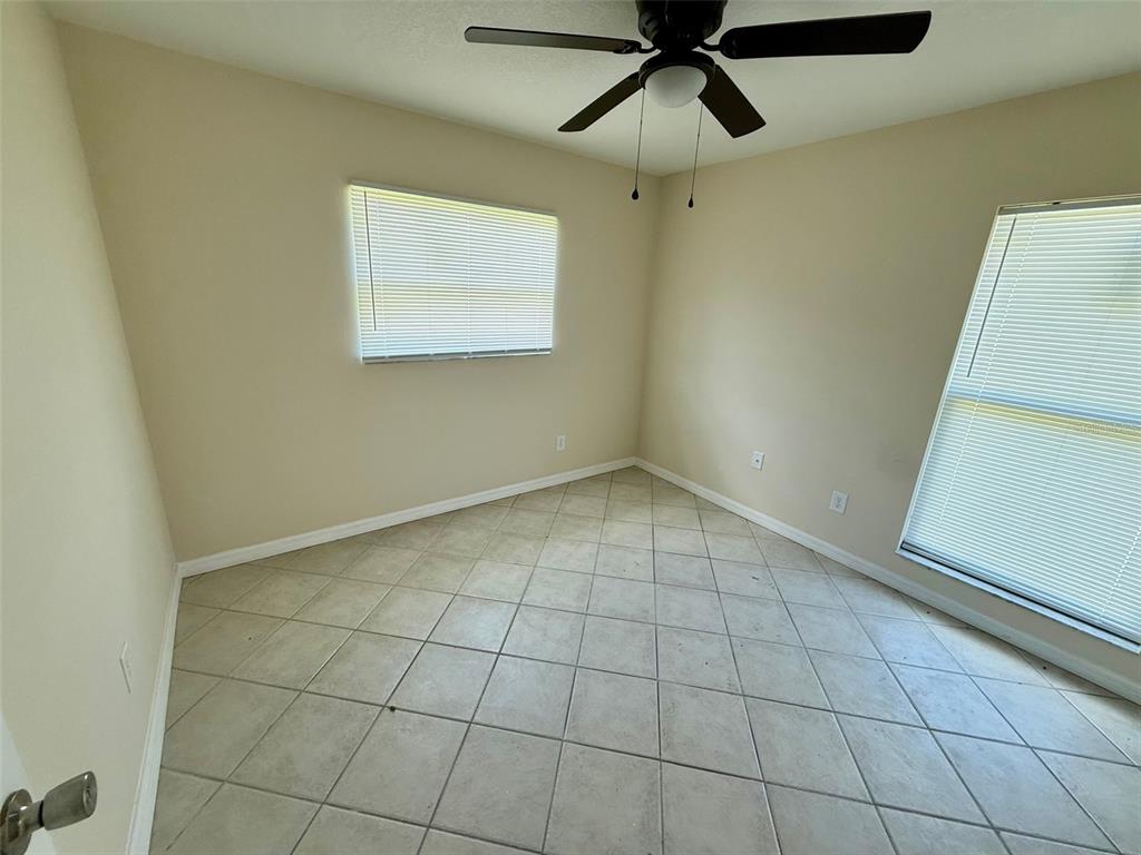 7319 Holiday Drive Spring Hill, FL 34606 - Photo 10 of 20 a view of an empty room with a window