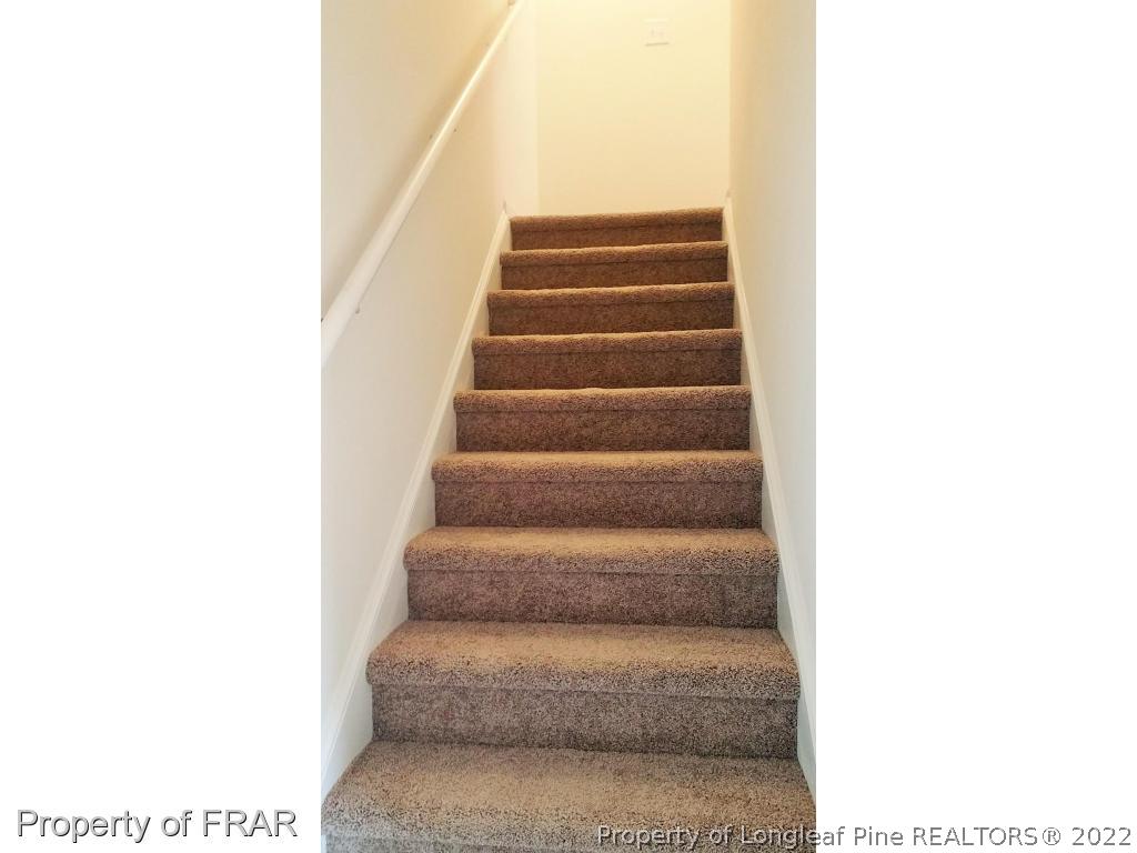 12 River Oak Street Spring Lake, NC 28390 - Photo 13 of 34 a view of staircase with white walls