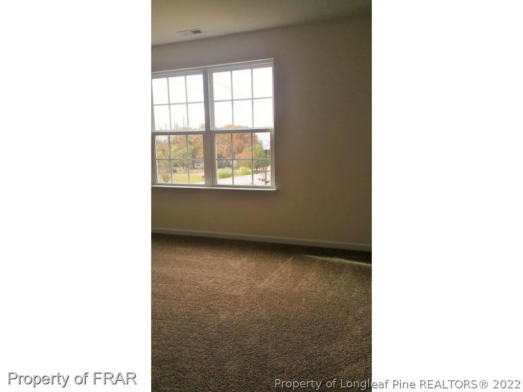 12 River Oak Street Spring Lake, NC 28390 - Photo 21 of 34 a view of an empty room with a window