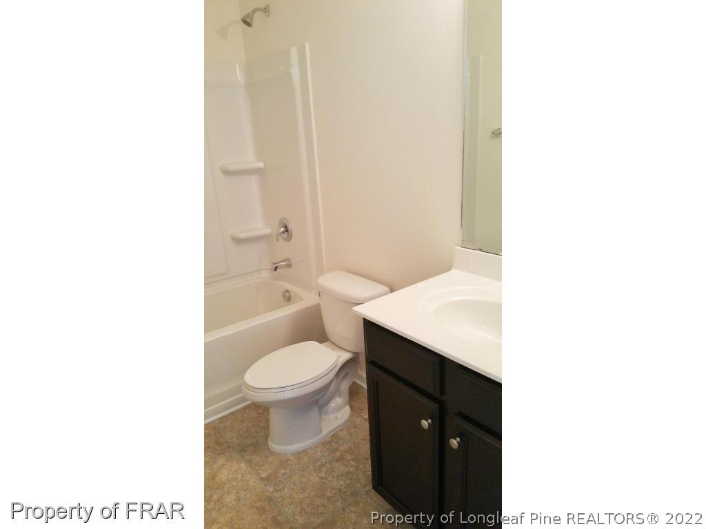 12 River Oak Street Spring Lake, NC 28390 - Photo 23 of 34 a bathroom with a sink a toilet and a bathtub