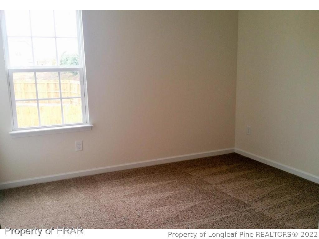 12 River Oak Street Spring Lake, NC 28390 - Photo 24 of 34 an empty room with a window