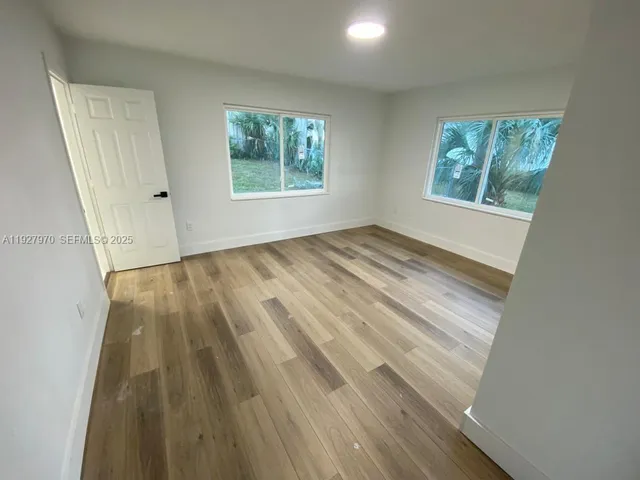 a view of a room that has a window in it