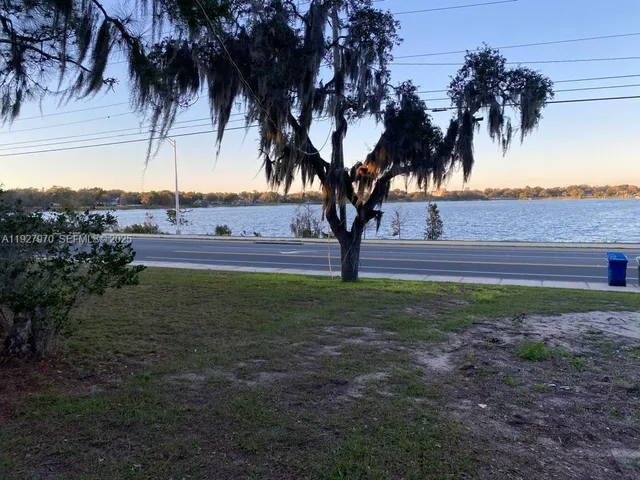 a view of a lake with a car parked