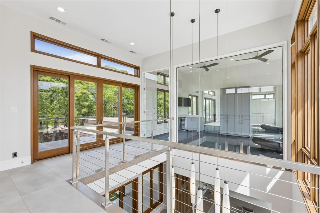 548 Oak Grove Lane Coppell, TX 75019 - Photo 28 of 36 a view of a big room with balcony and furniture