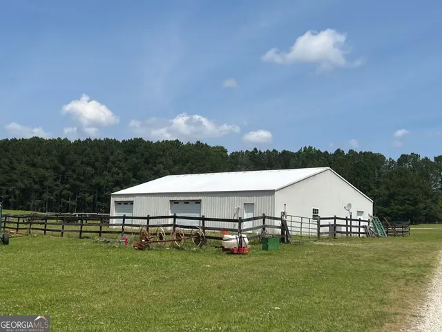 a aerial view of a house with table and chairs