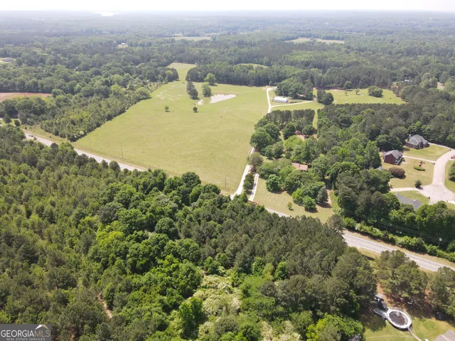 an aerial view of residential house with outdoor space