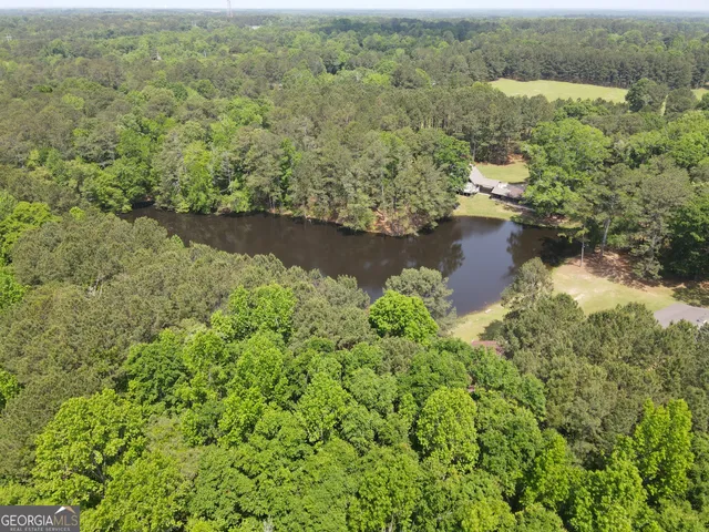 an aerial view of mountain with lake view