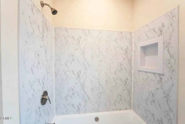 a bathroom with a shower curtain