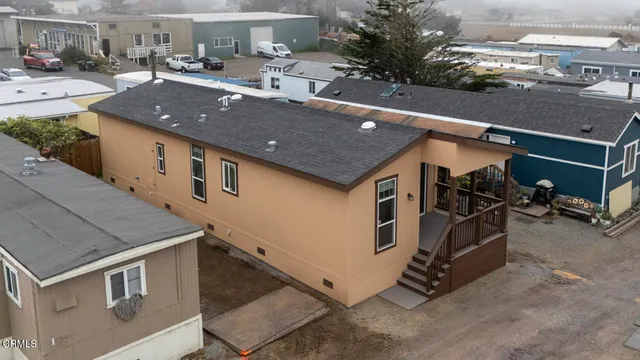 a view of a patio with table and chairs
