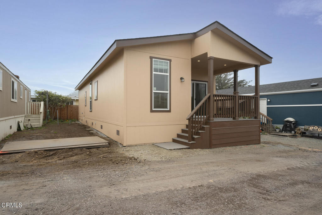 1021 South Main Street, Unit 2 Fort Bragg, CA 95437 - Photo 2 of 19 a front view of a house with garage