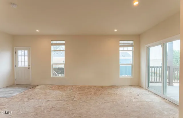 a view of an empty room and window