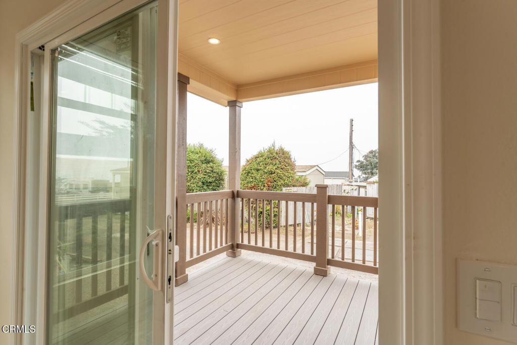 1021 South Main Street, Unit 2 Fort Bragg, CA 95437 - Photo 8 of 19 a view of a balcony with wooden floor
