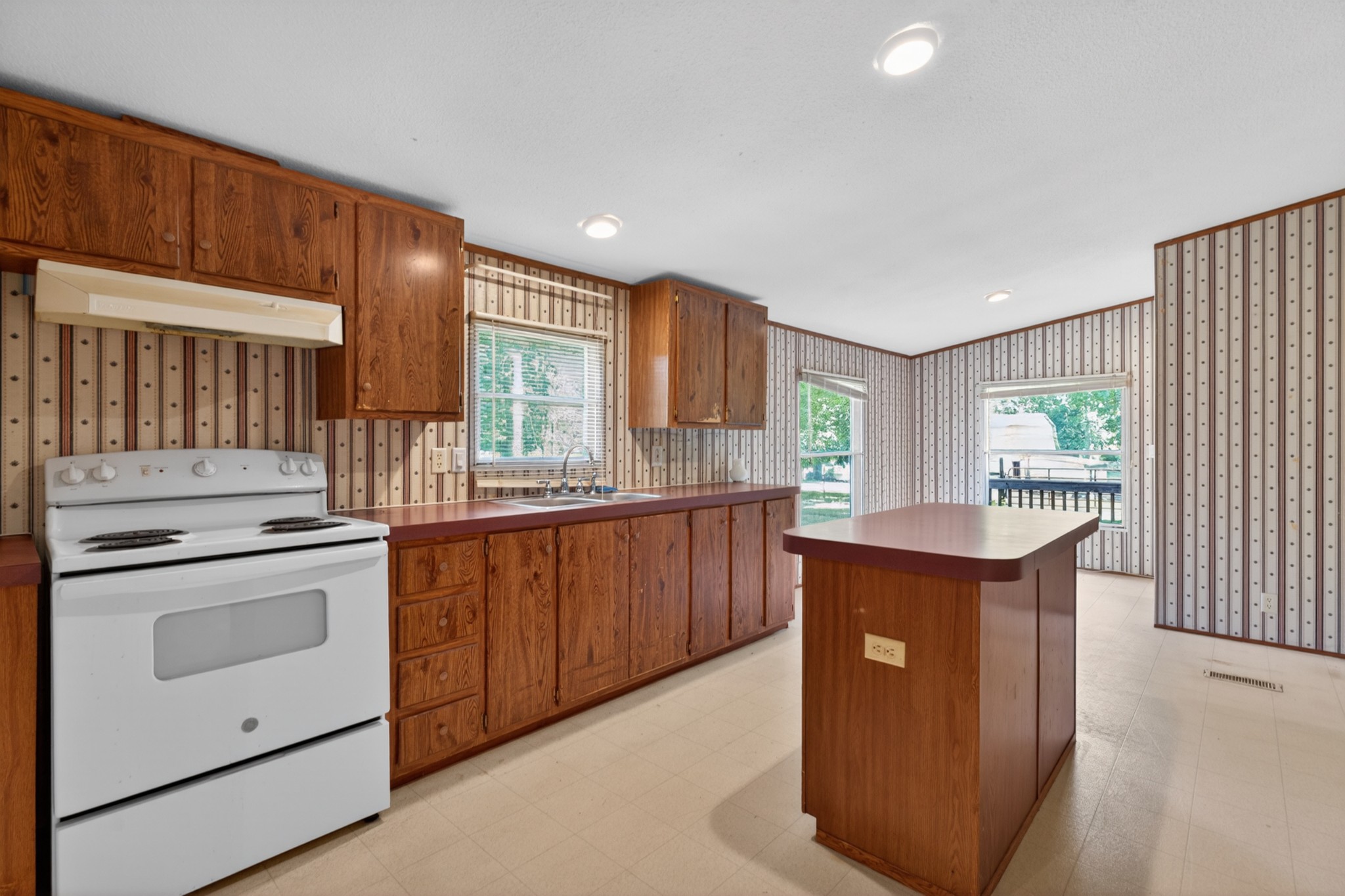 228 Shasteen Ridge Road Lynchburg, TN 37352 - Photo 26 of 53 a kitchen with stainless steel appliances granite countertop a stove and a sink