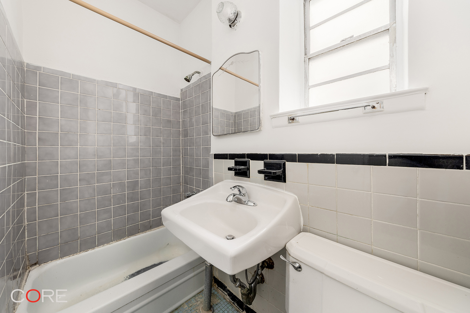 415 East 80th Street, Unit 5S Manhattan, NY 10075 - Photo 6 of 10 a bathroom with a sink a toilet and shower