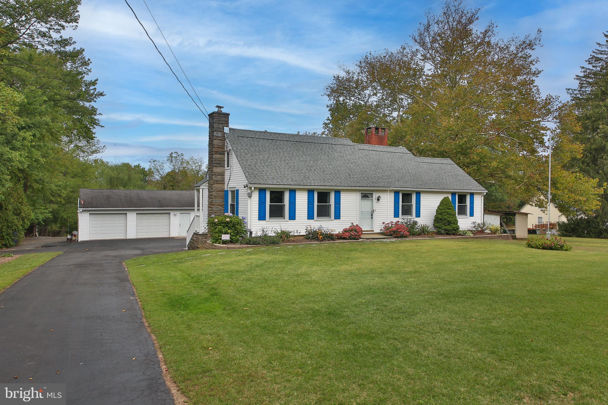 150 Edison Furlong Road Doylestown, PA 18901 - Photo 1 of 36 a front view of a house with a garden