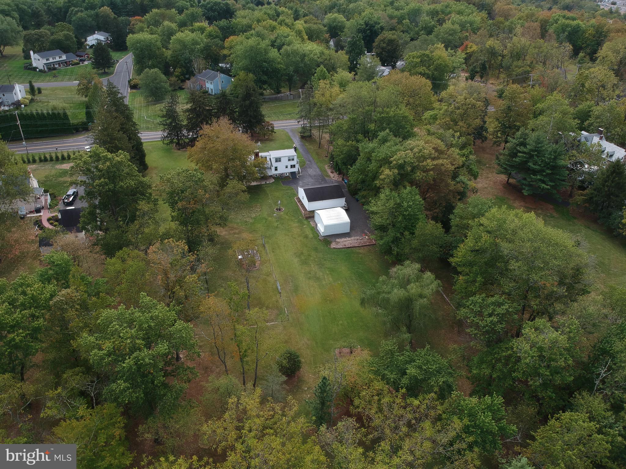 150 Edison Furlong Road Doylestown, PA 18901 - Photo 12 of 36 an aerial view of residential house with outdoor space and trees all around
