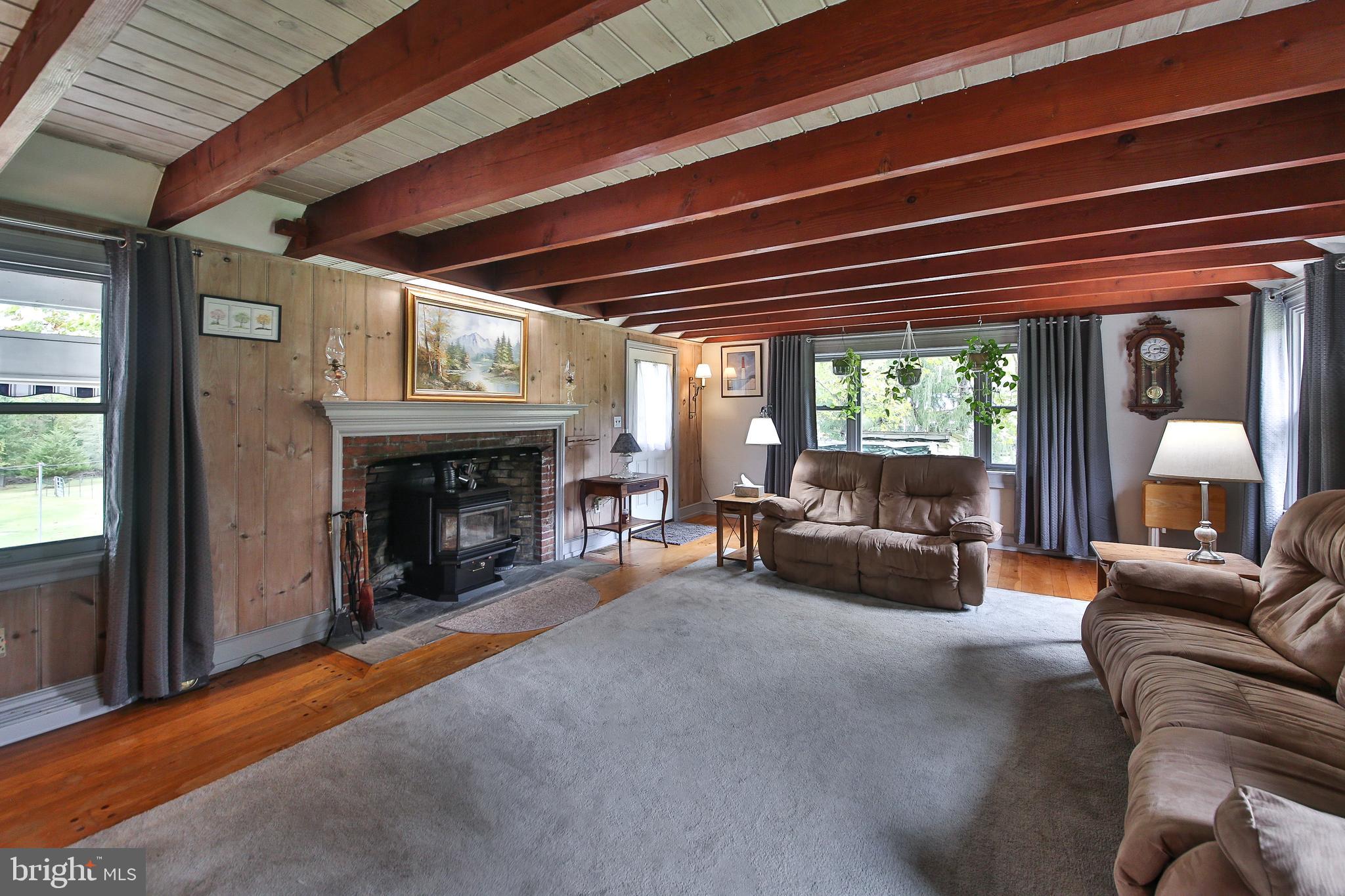 150 Edison Furlong Road Doylestown, PA 18901 - Photo 14 of 36 a living room with furniture and a fireplace