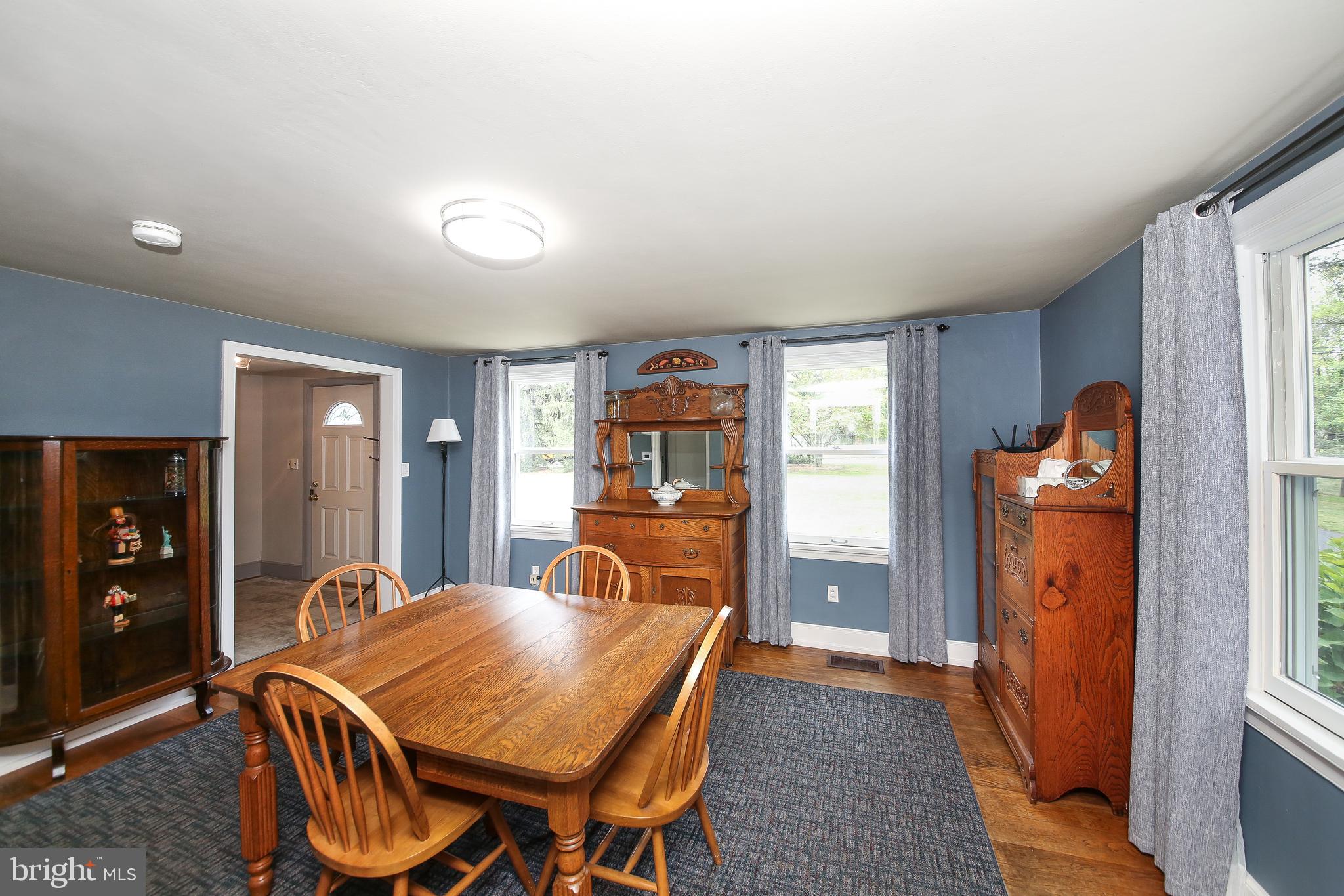 150 Edison Furlong Road Doylestown, PA 18901 - Photo 17 of 36 a view of a dining room with furniture window and wooden floor