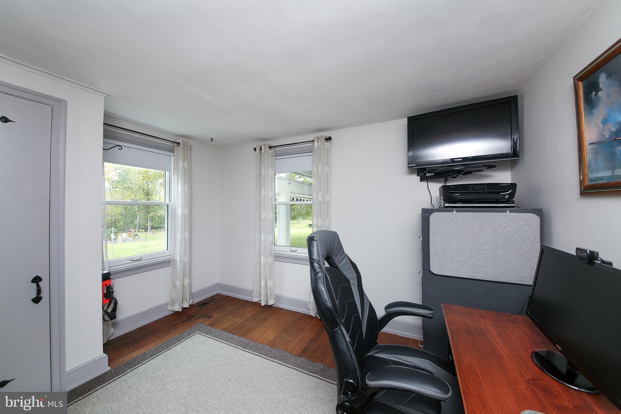 150 Edison Furlong Road Doylestown, PA 18901 - Photo 20 of 36 a living room with furniture and a flat screen tv