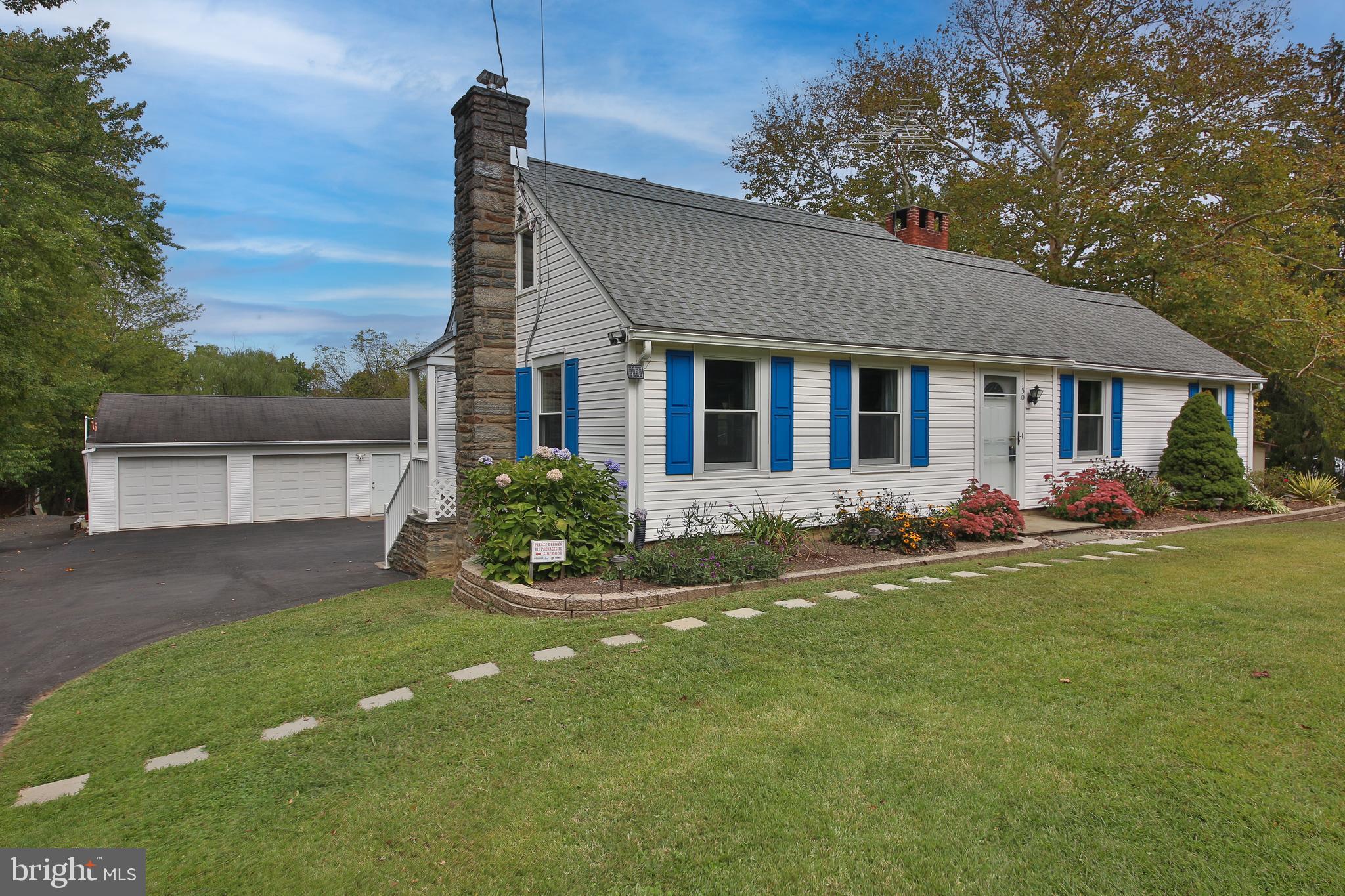 150 Edison Furlong Road Doylestown, PA 18901 - Photo 2 of 36 a front view of a house with a garden