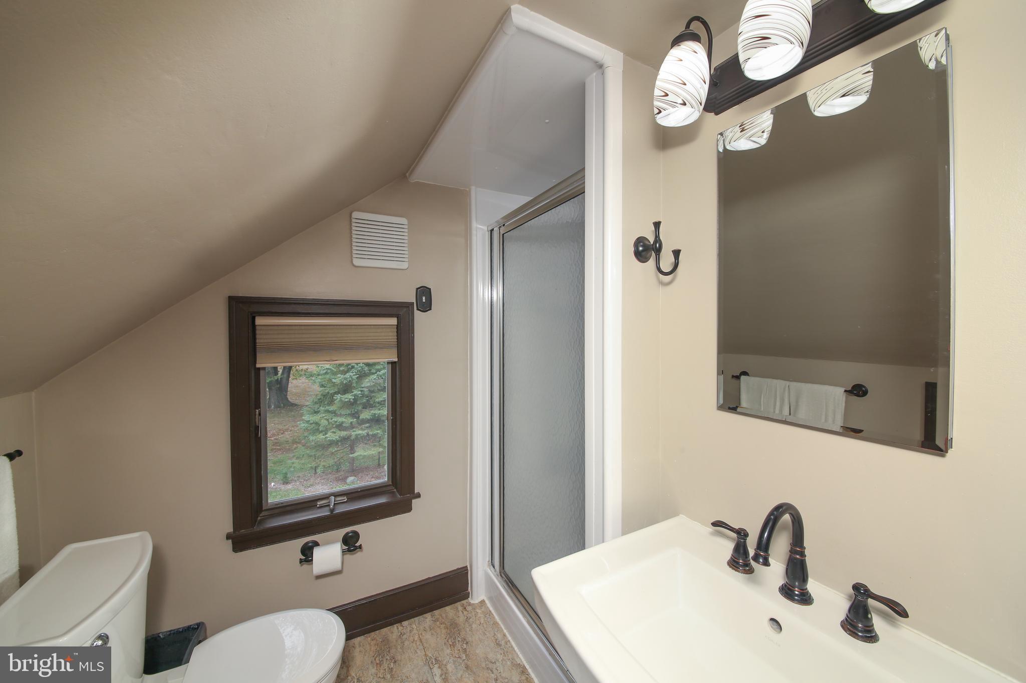 150 Edison Furlong Road Doylestown, PA 18901 - Photo 26 of 36 a bathroom with a sink a toilet and a mirror