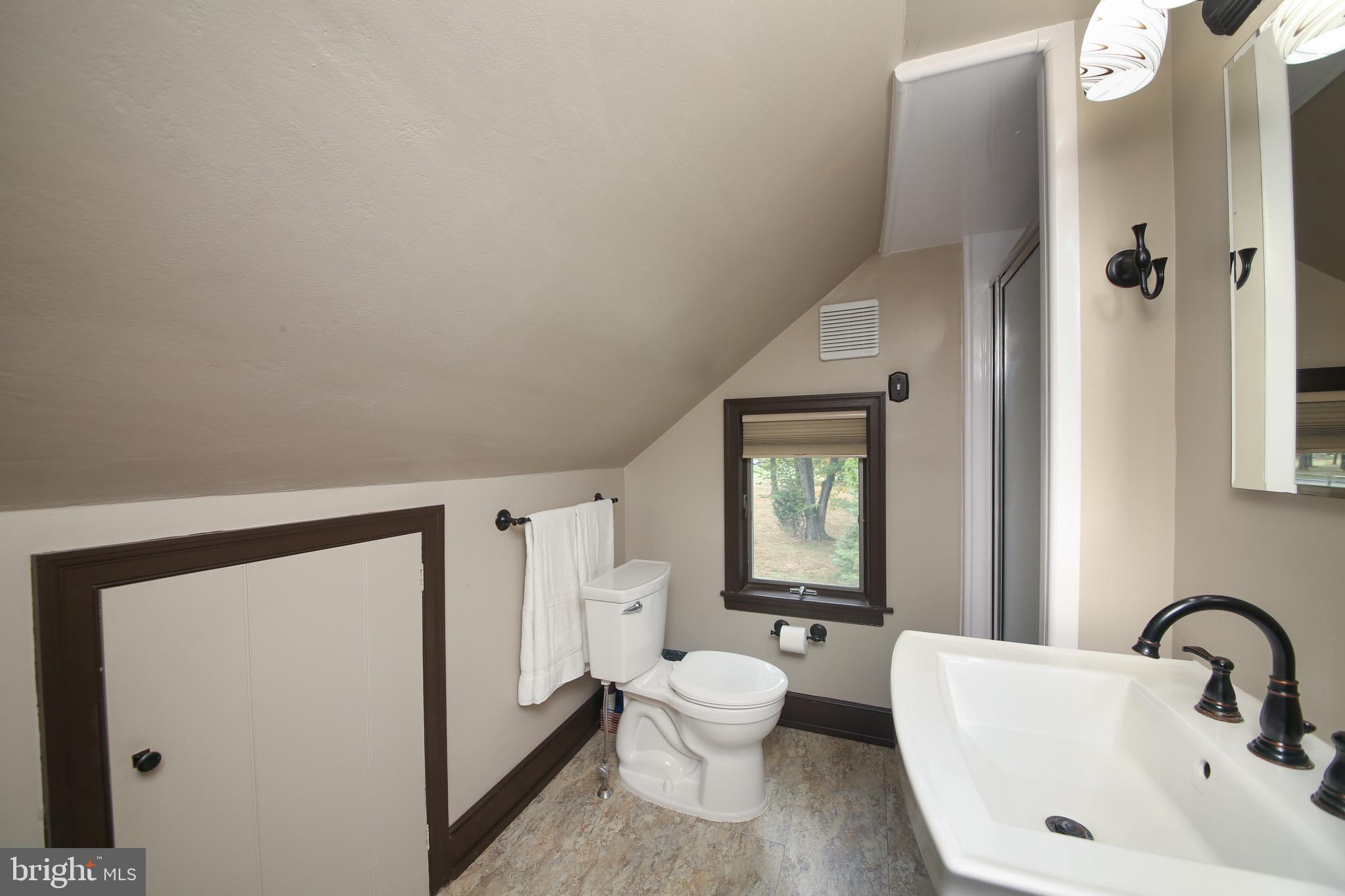 150 Edison Furlong Road Doylestown, PA 18901 - Photo 27 of 36 a bathroom with a toilet sink and a mirror