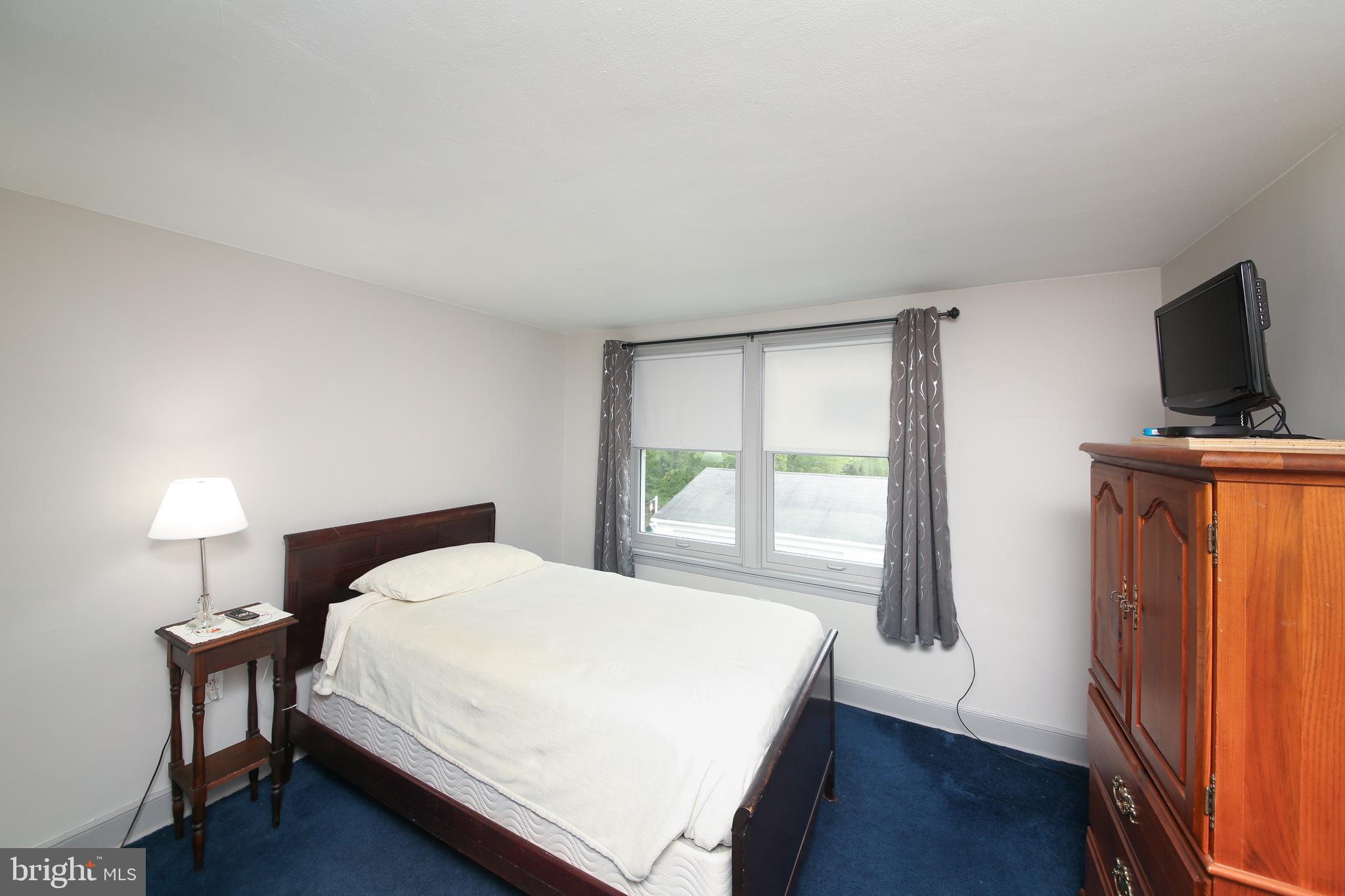 150 Edison Furlong Road Doylestown, PA 18901 - Photo 28 of 36 a bedroom with a bed and a flat screen tv