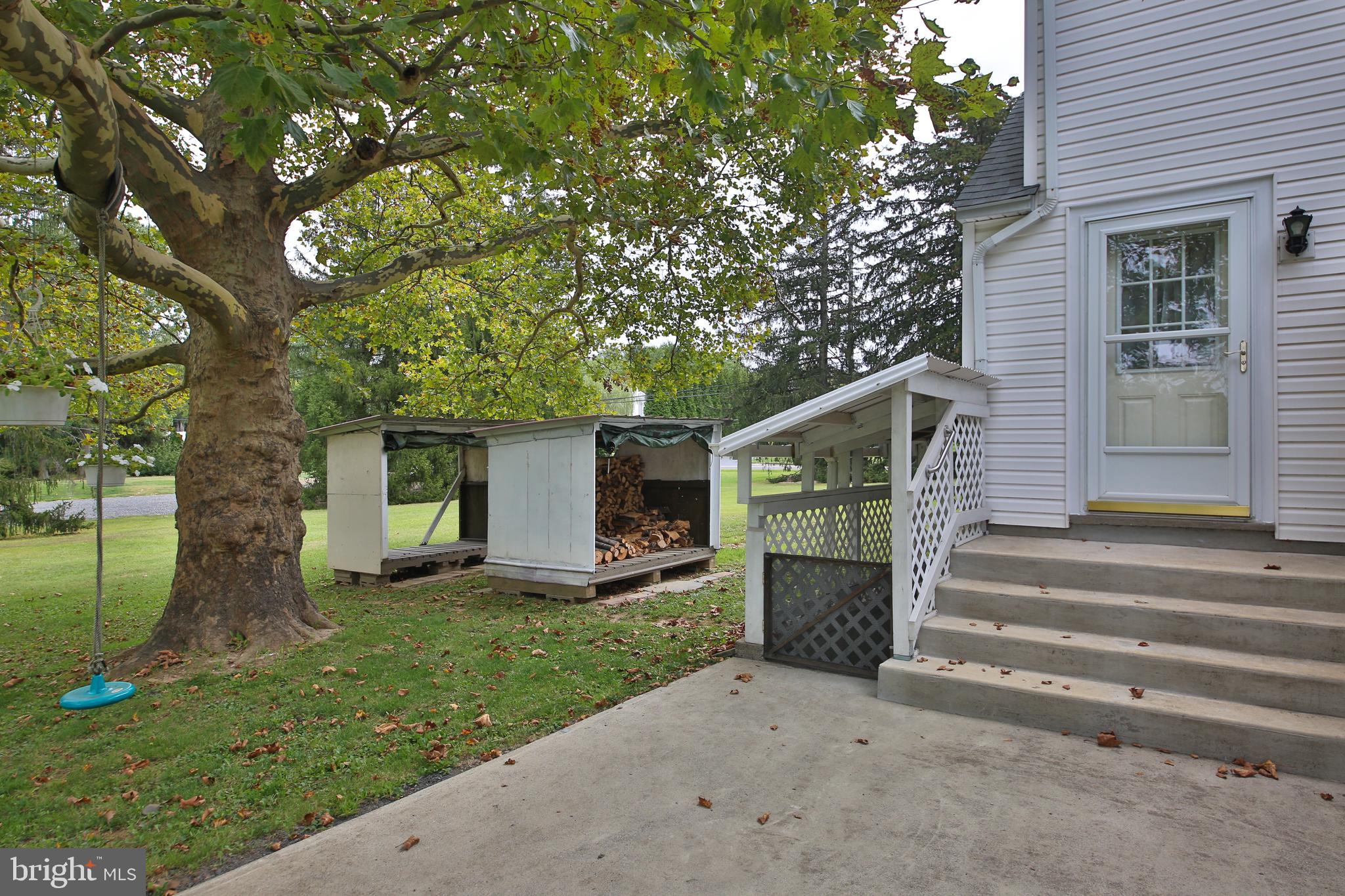 150 Edison Furlong Road Doylestown, PA 18901 - Photo 32 of 36 a front view of a house with a yard and garage