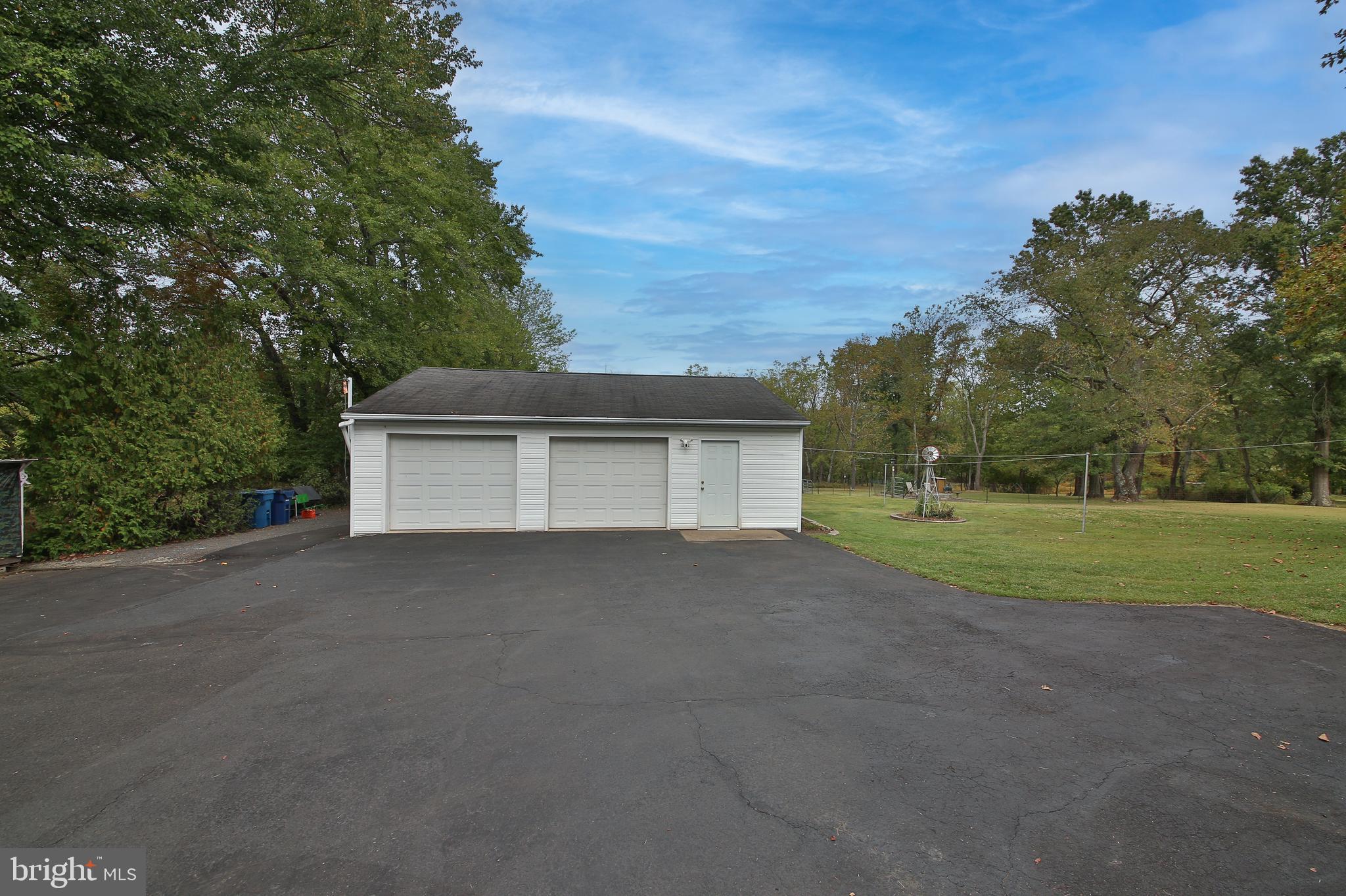 150 Edison Furlong Road Doylestown, PA 18901 - Photo 6 of 36 a view of a house with a yard and garage