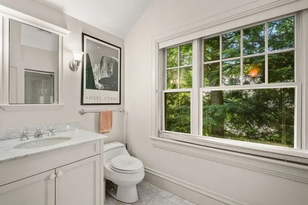 a bedroom with furniture and window