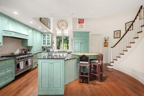 a view of a dining room with furniture and a floor to ceiling window