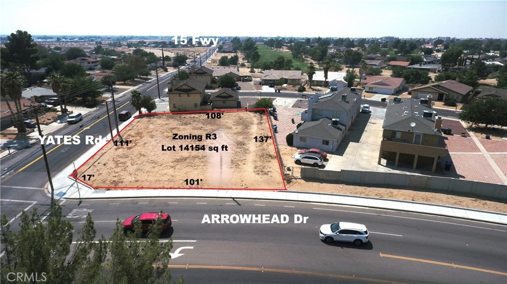 an outdoor space with seating area and trees in the background