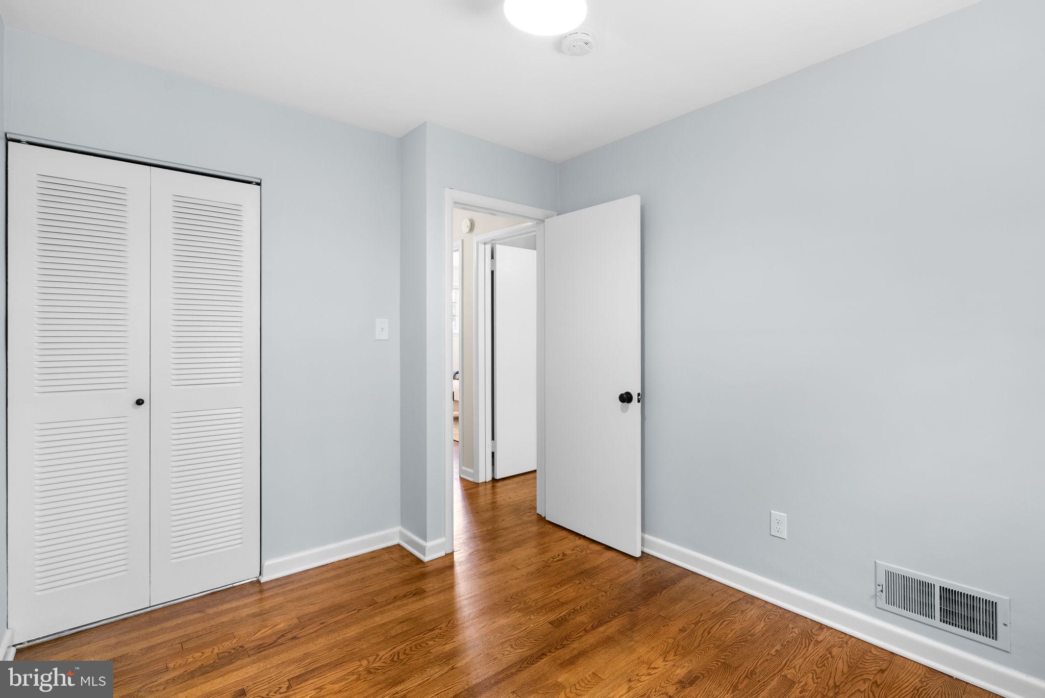 9907 Big Rock Road Silver Spring, MD 20901 - Photo 20 of 45 a view of an empty room with wooden floor