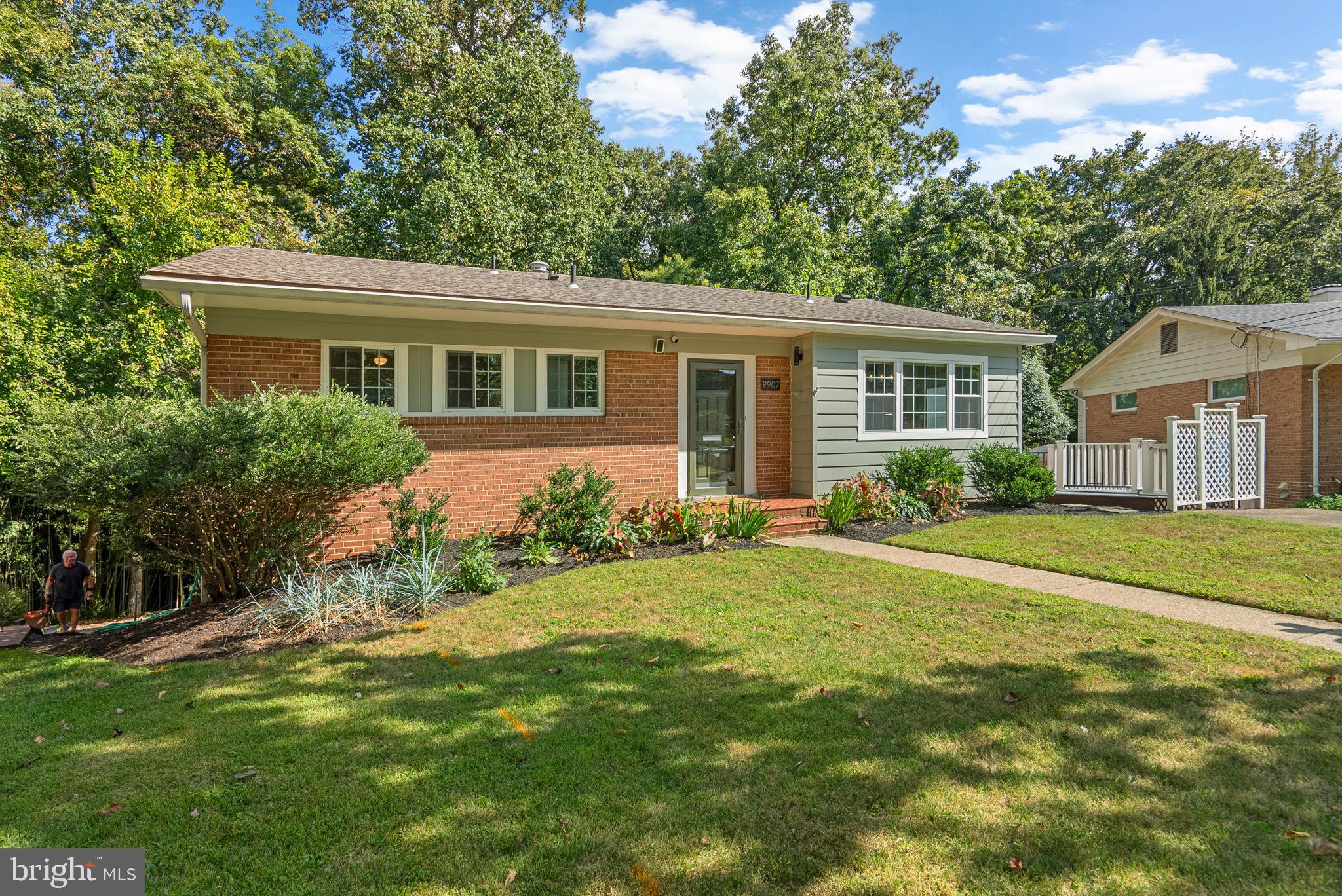 9907 Big Rock Road Silver Spring, MD 20901 - Photo 2 of 45 a front view of house with yard and green space