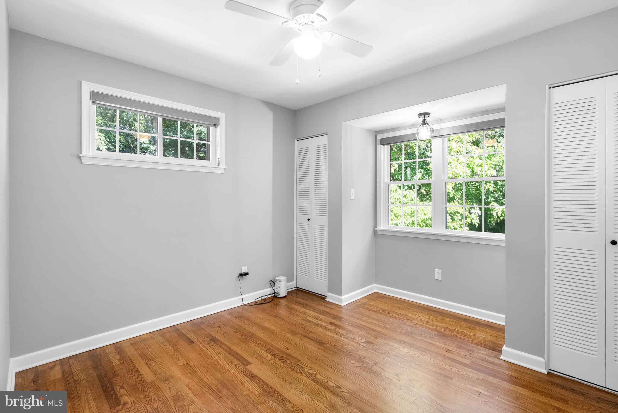 9907 Big Rock Road Silver Spring, MD 20901 - Photo 21 of 45 a view of a room with wooden floor and natural light