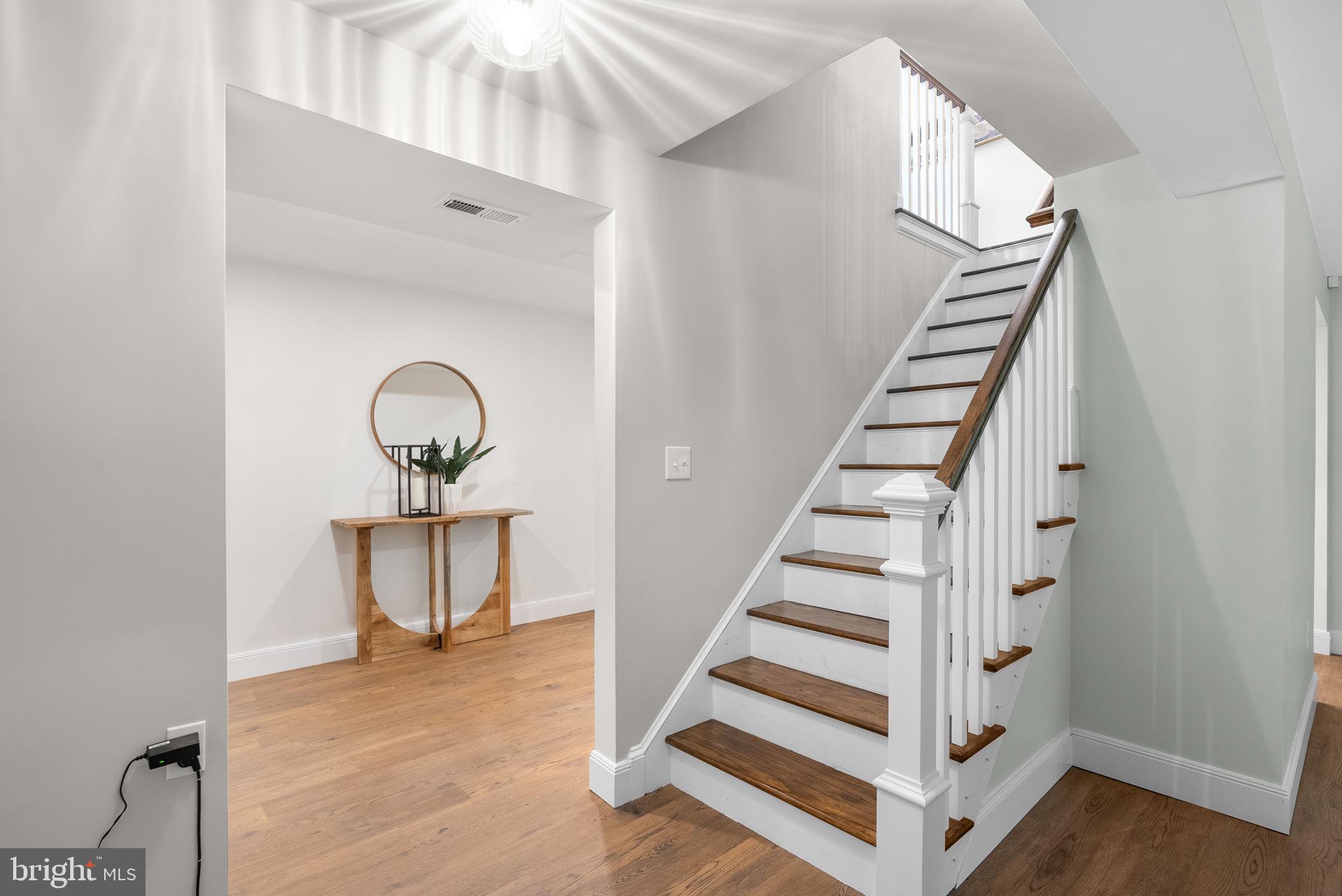 9907 Big Rock Road Silver Spring, MD 20901 - Photo 26 of 45 a view of entryway and hall with wooden floor