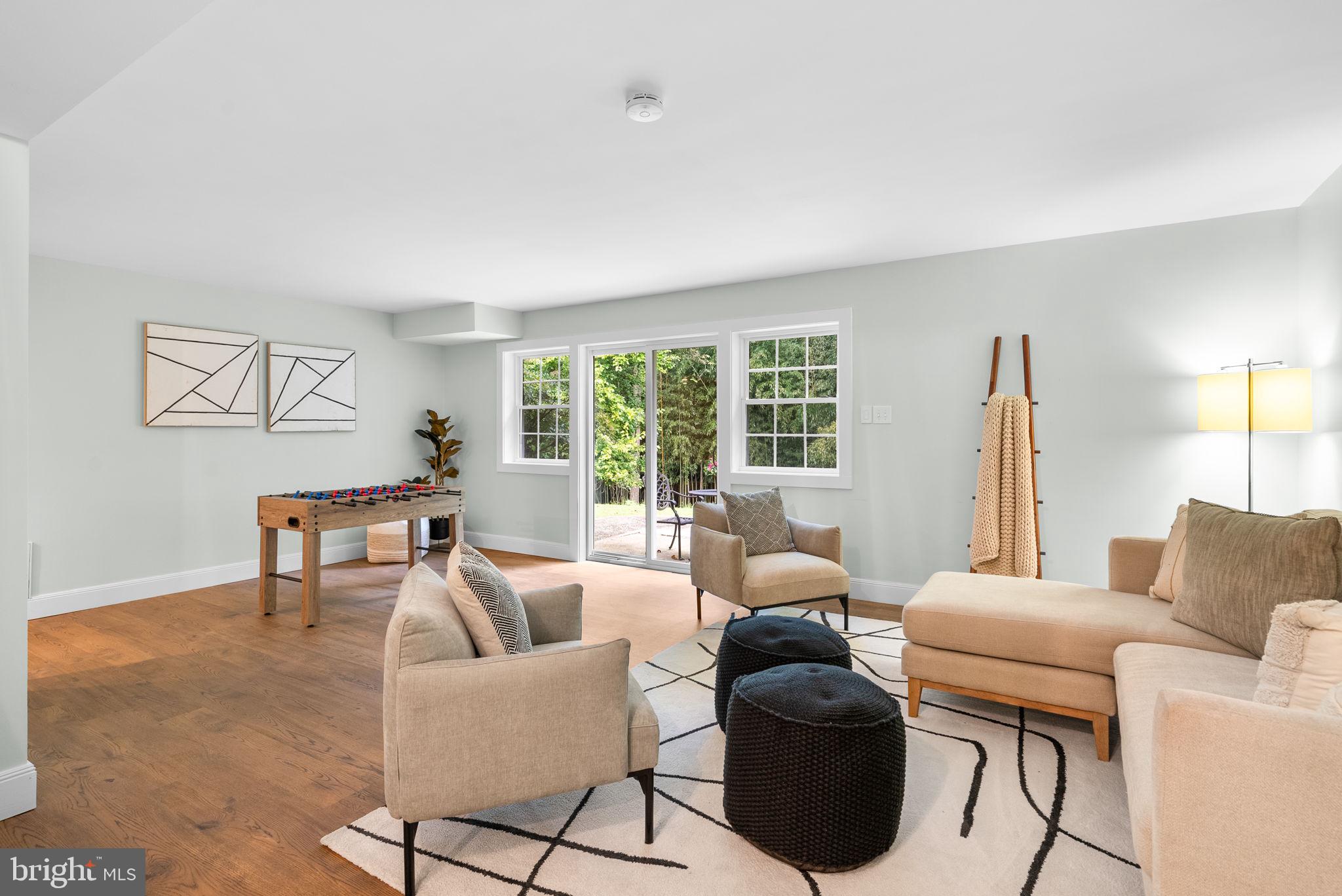 9907 Big Rock Road Silver Spring, MD 20901 - Photo 27 of 45 a living room with furniture and a large window